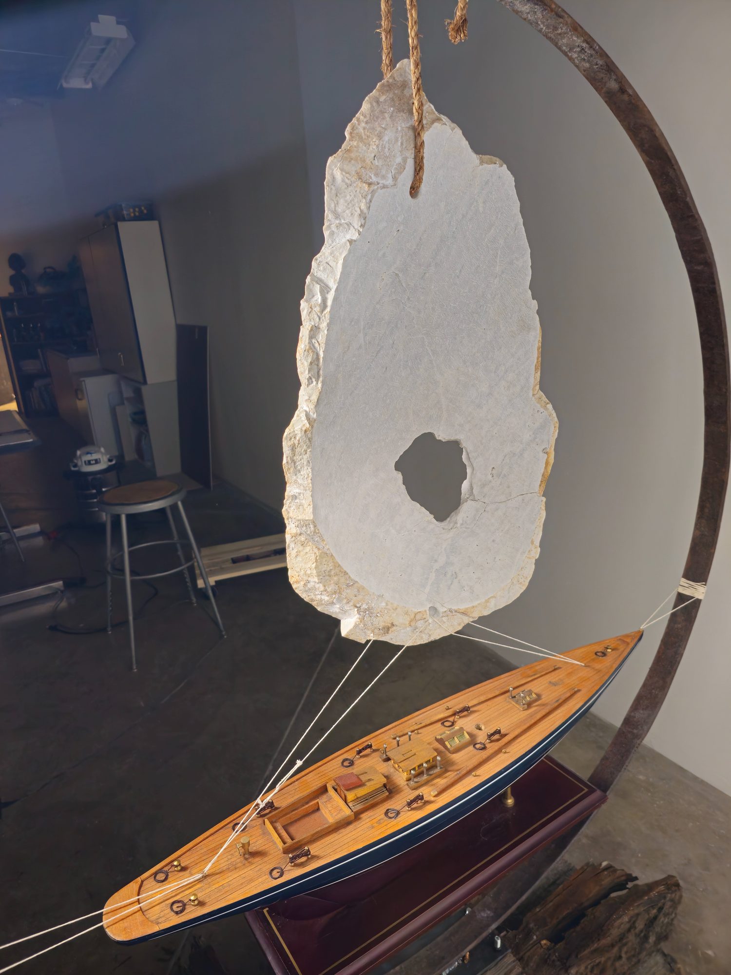 Utah sculptor Byron Ramos working on a Utah marble stone sail sculpture